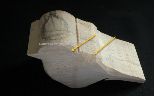 Arrows showing you where I have started whittling.